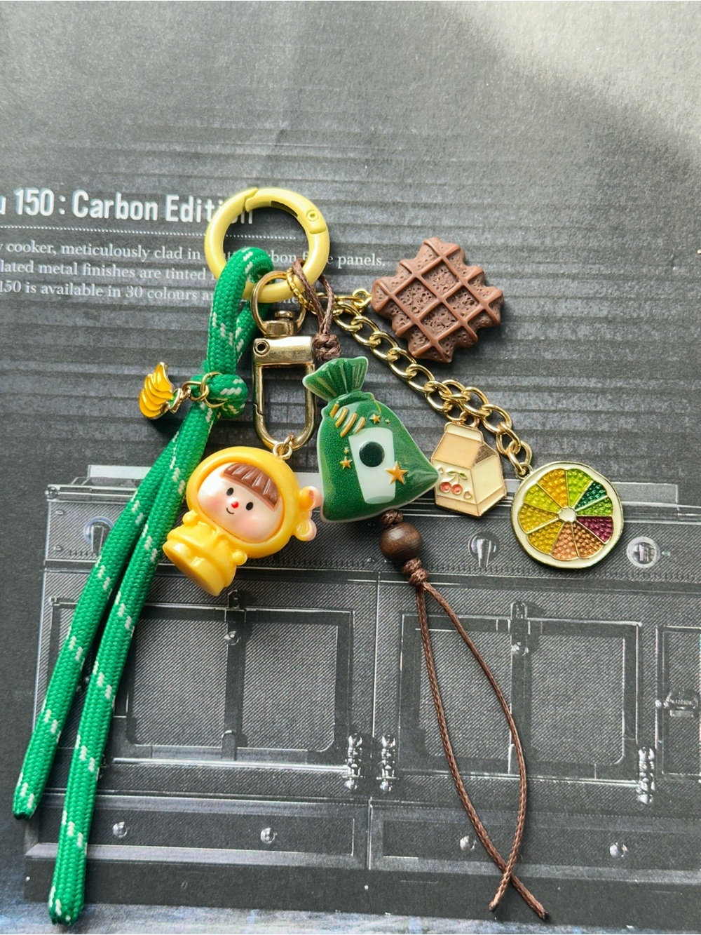 Green Charm Keychain with Yellow Astronaut Doll